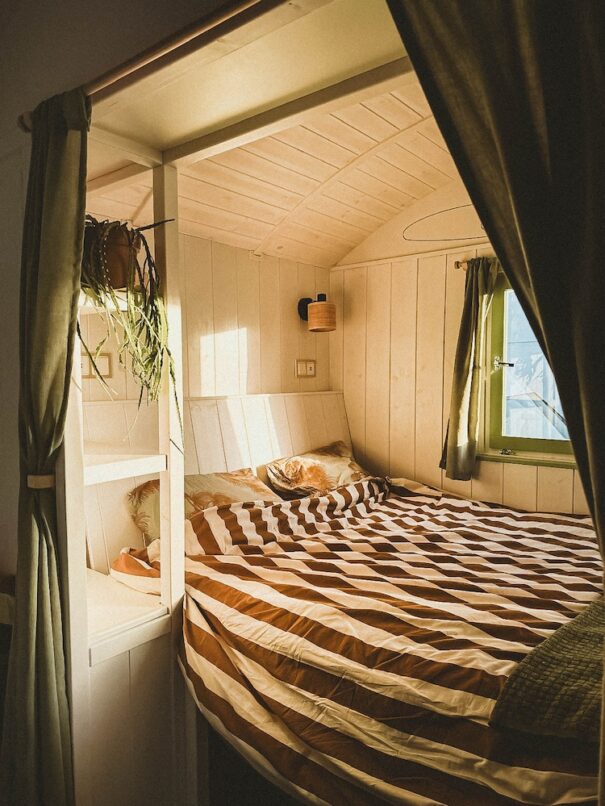 cosy bed area inside a shepherds hut